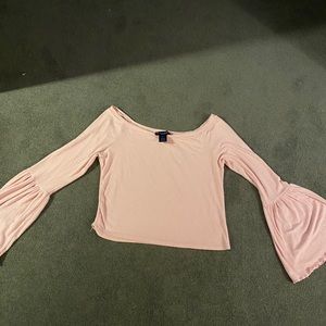 Pink soft shirt with flared sleeves.